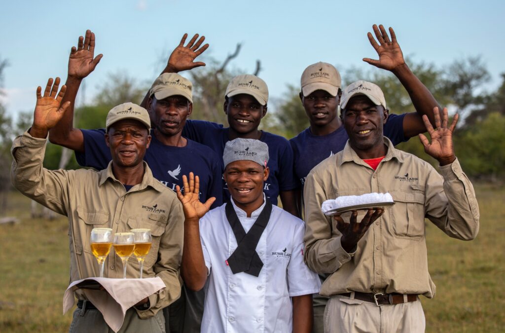 The camp crew waving in welcome